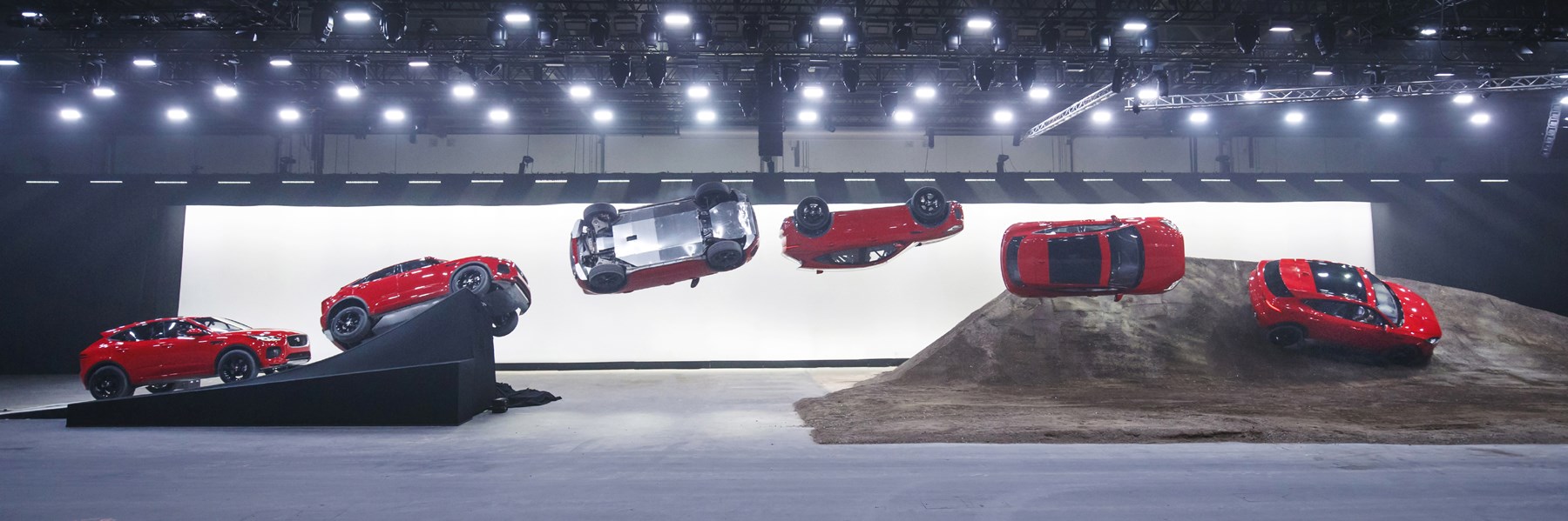 NOTE: IMAGE STRICTLY EMBARGOED UNTIL 20.00 BST, JULY 13th 2017. NO ONLINE USE PRIOR TO THIS TIME. Jaguar and stunt driver Terry Grant set a new Guinness World Record for longest barrel roll at the global launch of the new Jaguar E-PACE at ExCel London. (Image composite)